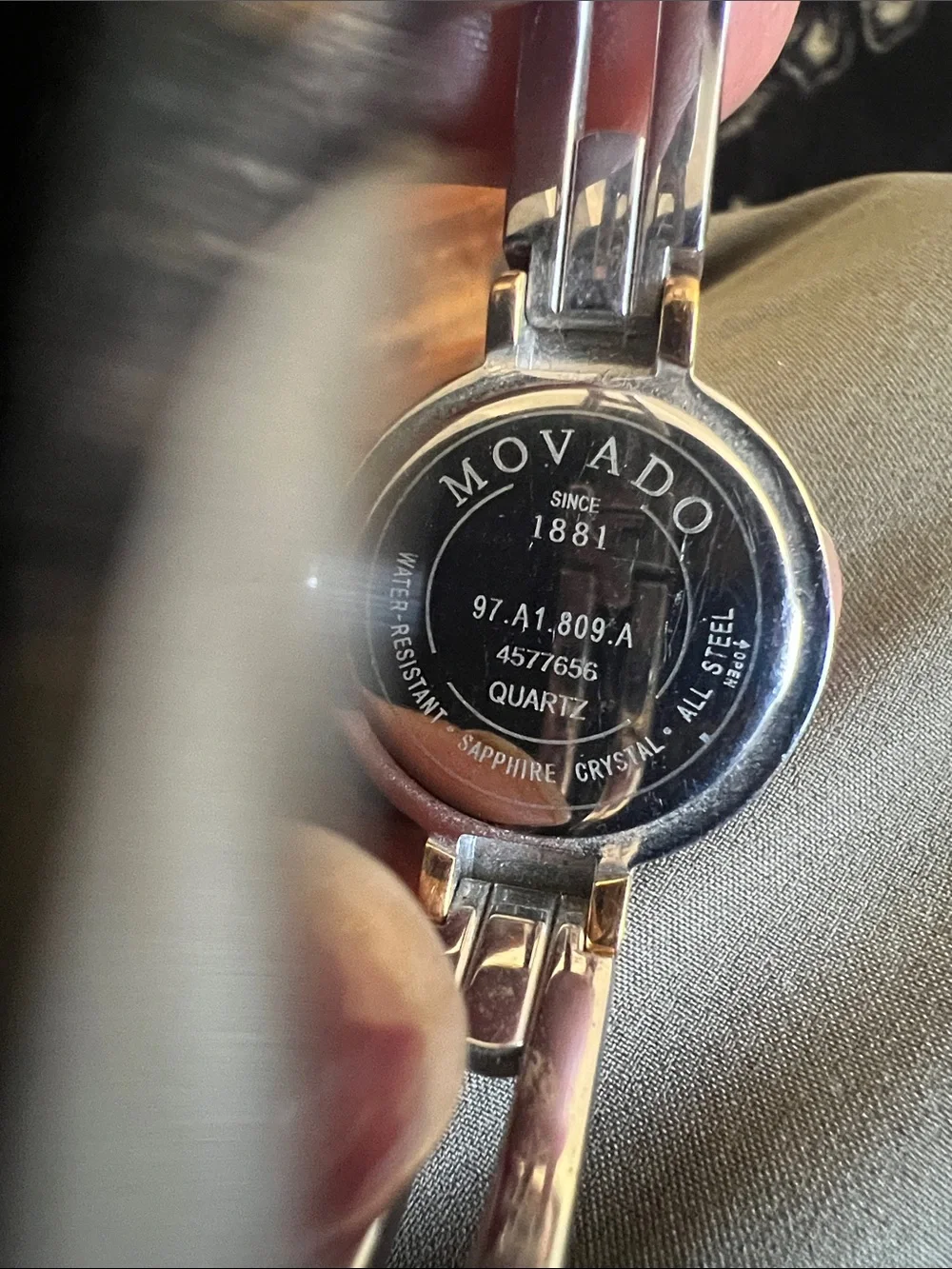 Movado model 97 A1809A Two-Tone Black Dial Silver and Gold Bracelet Watch